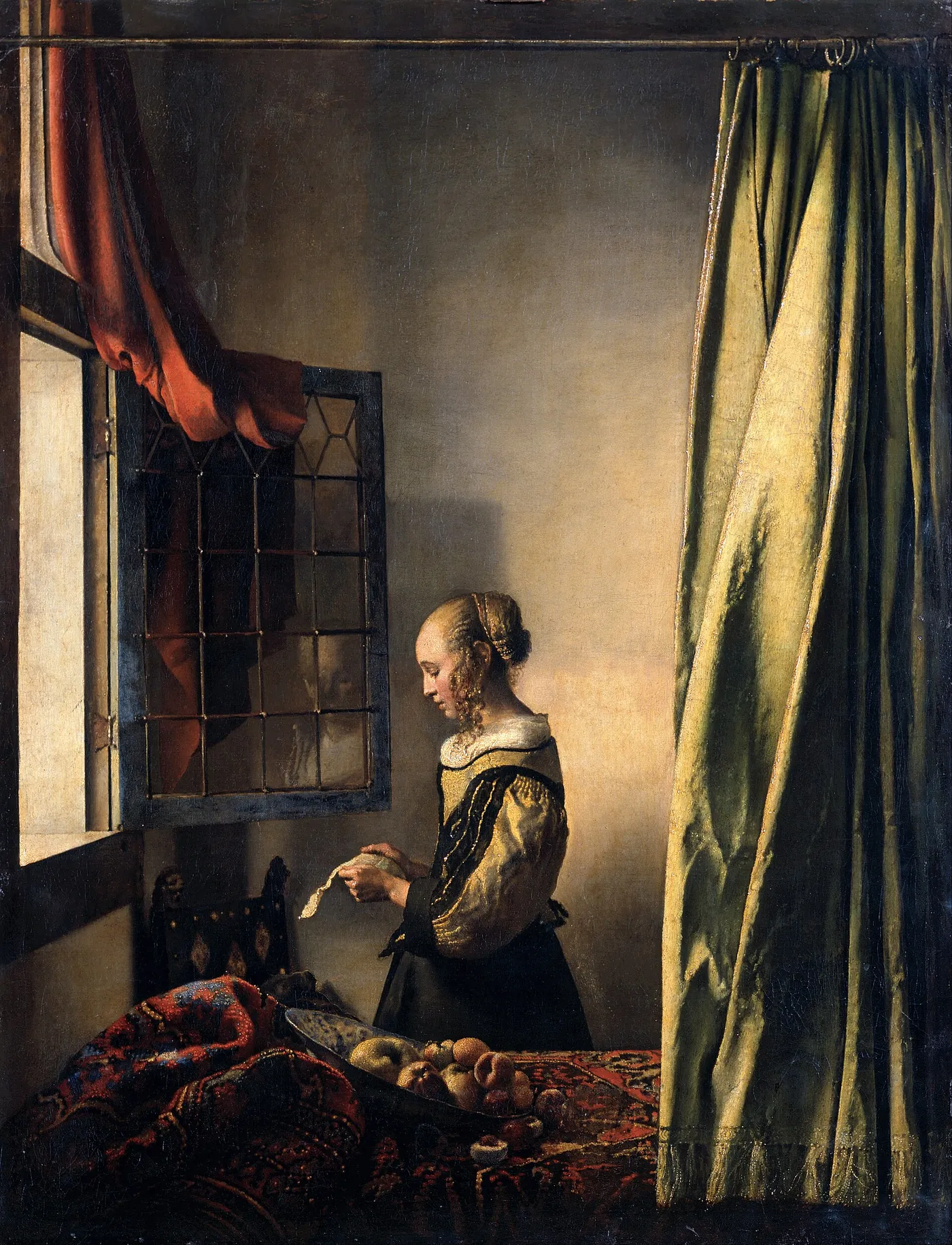 Johannes Vermeer, Girl Reading a Letter at an Open Window: a young woman reads by a window with a green curtain.